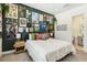 Eclectic bedroom filled with posters featuring a queen bed with white linens and colorful pillows at 12155 Sage Thunder Ave, Las Vegas, NV 89138