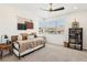 Cozy bedroom featuring a daybed, a large window, and carpeted floors at 12155 Sage Thunder Ave, Las Vegas, NV 89138