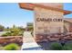 Elegant community entrance featuring stone signage and manicured landscaping leading to a secure gated neighborhood at 12155 Sage Thunder Ave, Las Vegas, NV 89138