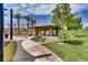 Well-appointed community park with covered seating, manicured lawns, and recreational elements for outdoor enjoyment at 12155 Sage Thunder Ave, Las Vegas, NV 89138