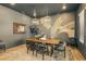 An elegant dining room features decorative wall art, stylish lighting, and a wooden table with seating for six at 12155 Sage Thunder Ave, Las Vegas, NV 89138