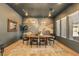 This dining room is bright and airy, featuring natural light, a decorative wall and contemporary furnishings at 12155 Sage Thunder Ave, Las Vegas, NV 89138
