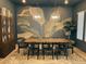 Beautiful dining room with statement wall art, stylish light fixtures, and a long wooden dining table at 12155 Sage Thunder Ave, Las Vegas, NV 89138