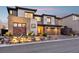 Charming home showcasing a modern exterior, stone landscaping, and a spacious driveway at 12155 Sage Thunder Ave, Las Vegas, NV 89138