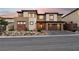 Beautiful two-story home showcasing modern architecture, neutral colors, and a well-manicured front yard at 12155 Sage Thunder Ave, Las Vegas, NV 89138