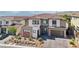 Beautiful two-story home with modern design, desert landscaping, and a two-car garage at 12155 Sage Thunder Ave, Las Vegas, NV 89138