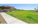 Expansive green space with covered picnic area and well-maintained landscaping, perfect for outdoor activities at 12155 Sage Thunder Ave, Las Vegas, NV 89138