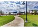 Lush green space with walking paths and shaded structures in a planned community at 12155 Sage Thunder Ave, Las Vegas, NV 89138