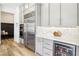 Kitchen area showcasing stainless steel appliances, gray cabinets, and a beverage cooler at 12155 Sage Thunder Ave, Las Vegas, NV 89138