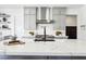 Beautiful kitchen with stainless steel appliances, marble countertops and backsplash, and gray cabinets at 12155 Sage Thunder Ave, Las Vegas, NV 89138