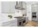 Gourmet kitchen features marble countertops, stainless steel appliances, and grey cabinets at 12155 Sage Thunder Ave, Las Vegas, NV 89138