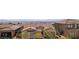 Scenic view of a residential neighborhood with tiled roofs, desert landscaping, and mountain views at 12155 Sage Thunder Ave, Las Vegas, NV 89138