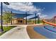 Community playground featuring shaded areas and play equipment in a landscaped environment at 12155 Sage Thunder Ave, Las Vegas, NV 89138