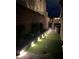 Outdoor putting green with landscape lighting, providing an inviting space for nighttime golf practice at 12155 Sage Thunder Ave, Las Vegas, NV 89138