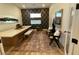 Bright sitting area featuring a decorative wall, modern furnishings, and a stylish accent rug on the light wood floor at 12155 Sage Thunder Ave, Las Vegas, NV 89138
