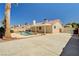 Spacious backyard features a pool and covered patio, ideal for outdoor entertaining at 1536 Leatherleaf Dr, Las Vegas, NV 89123