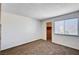 Bright bedroom features neutral walls, carpeted floor, window, and walk-in closet at 1536 Leatherleaf Dr, Las Vegas, NV 89123