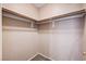 Well-organized walk-in closet featuring rods and shelves for ample storage space at 1536 Leatherleaf Dr, Las Vegas, NV 89123