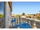 Balcony with scenic views, adorned with a blue table and chair set at 1538 Pony Ranch Cir, Henderson, NV 89014