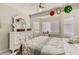 Charming bedroom with a white dresser, ceiling fan, and three windows at 1538 Pony Ranch Cir, Henderson, NV 89014