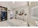 Cozy bedroom with closet, white dresser, and soft natural light from the window at 1538 Pony Ranch Cir, Henderson, NV 89014