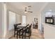 Bright dining area with modern table, chairs, and natural light near the kitchen at 1538 Pony Ranch Cir, Henderson, NV 89014