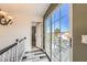 Light-filled hallway featuring wood floors and sliding doors that lead to the outdoor patio at 1538 Pony Ranch Cir, Henderson, NV 89014