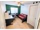 Functional home office featuring a desk, sofa, and ample natural light at 1538 Pony Ranch Cir, Henderson, NV 89014
