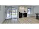 Dining area features access to backyard patio and a modern bar area at 1673 Golden Vista Dr, Las Vegas, NV 89123