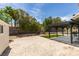 Spacious backyard with pergola, artificial turf, desert landscaping, and block wall for privacy at 1673 Golden Vista Dr, Las Vegas, NV 89123