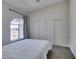 Inviting bedroom with white walls, carpet, a large window, and a bed with white linens at 1673 Golden Vista Dr, Las Vegas, NV 89123