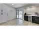 Bright dining area boasts modern white cabinets, bar area, and access to backyard at 1673 Golden Vista Dr, Las Vegas, NV 89123