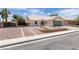 Well-maintained single-story home with desert landscaping, a two-car garage, and a tile roof at 1673 Golden Vista Dr, Las Vegas, NV 89123