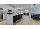 Modern kitchen with a quartz island and stainless steel appliances and black accents at 1673 Golden Vista Dr, Las Vegas, NV 89123