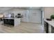 Bright kitchen with white cabinets, stainless appliances, and access to the backyard at 1673 Golden Vista Dr, Las Vegas, NV 89123