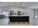 Bright kitchen featuring a large island with seating, stainless steel appliances, and lots of cabinet space at 1673 Golden Vista Dr, Las Vegas, NV 89123
