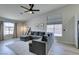 Cozy living room features lots of natural light and a stylish sectional sofa at 1673 Golden Vista Dr, Las Vegas, NV 89123