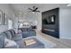 Modern living room that seamlessly connects with the adjacent kitchen and dining areas at 1673 Golden Vista Dr, Las Vegas, NV 89123