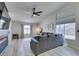 Bright living room with a large sectional and adjacent modern fireplace at 1673 Golden Vista Dr, Las Vegas, NV 89123