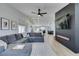 Spacious living room with stylish decor, a cozy fireplace, and an open floor plan that flows into the kitchen at 1673 Golden Vista Dr, Las Vegas, NV 89123