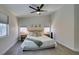 Relaxing main bedroom with plush bedding, side tables, soft carpet, and abundant natural light at 1673 Golden Vista Dr, Las Vegas, NV 89123