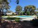 Refreshing community pool surrounded by lush greenery, perfect for relaxation at 171 Greenbriar Townhouse Way, Las Vegas, NV 89121