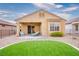 Home featuring a meticulously manicured lawn, a relaxing patio area, and a low maintenance landscape at 1782 Black Fox Canyon Rd, Henderson, NV 89052