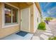 Home exterior featuring a secure front door, stone landscaping, and a charming outdoor setting at 1782 Black Fox Canyon Rd, Henderson, NV 89052