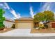 Home with well-manicured landscaping, a two-car garage, and a cozy front porch at 1782 Black Fox Canyon Rd, Henderson, NV 89052