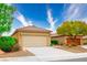 Charming home with a two-car garage, desert landscaping, and a well-maintained lawn at 1782 Black Fox Canyon Rd, Henderson, NV 89052