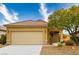 Charming single-story home features a well-maintained yard, two-car garage, and desert landscaping at 1782 Black Fox Canyon Rd, Henderson, NV 89052