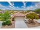 Charming single-story home with desert landscaping, a two-car garage, and a red tile roof in a quiet neighborhood at 1782 Black Fox Canyon Rd, Henderson, NV 89052