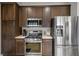 Updated kitchen features stainless steel appliances and dark wood cabinetry at 1782 Black Fox Canyon Rd, Henderson, NV 89052