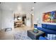 Open concept living room with access to the kitchen and dining area at 1782 Black Fox Canyon Rd, Henderson, NV 89052